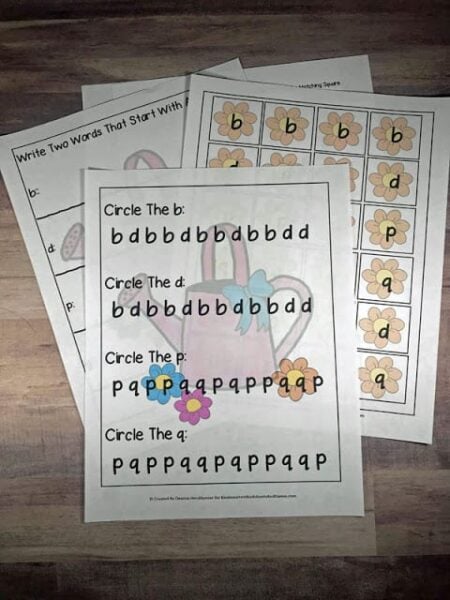 several b d reversal worksheets to practice letter reversals with sorting mat, circle the letter, write the letter, and more with a fun flower, waterming can, spring game