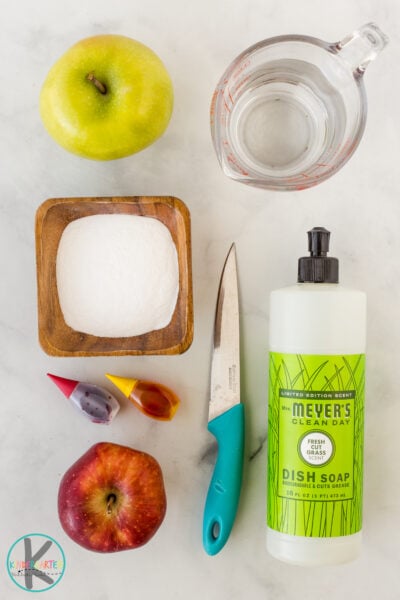 1/4 cup baking soda (give or take) 2 squirts dish soap 1/4 cup distilled white vinegar pipette or dropper (optional) food coloring (optional) apple (s) sharp knife plate with lip